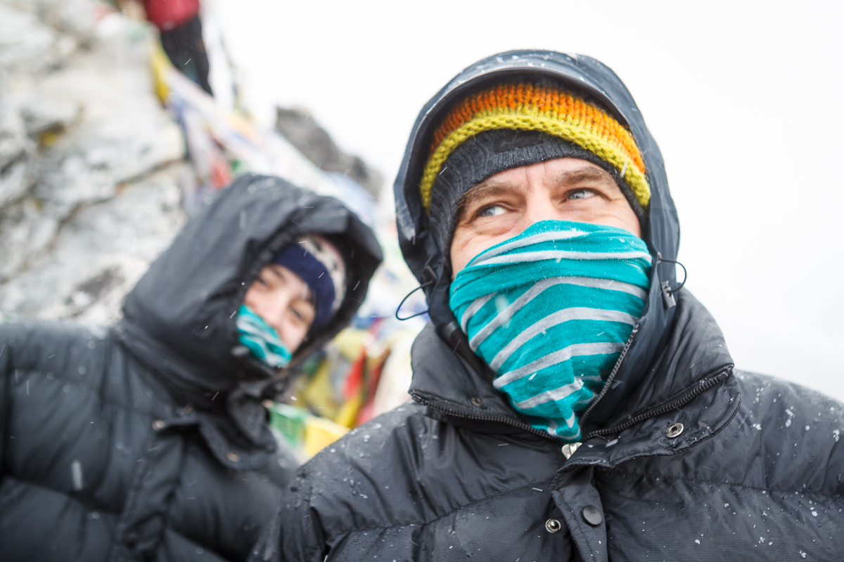 Two people wearing down jackets in cold weather